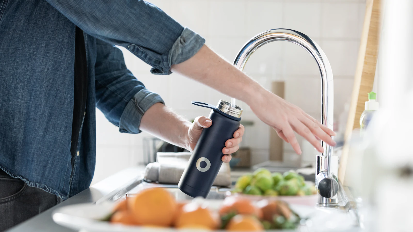 Water filter pitcher on a bright kitchen counter