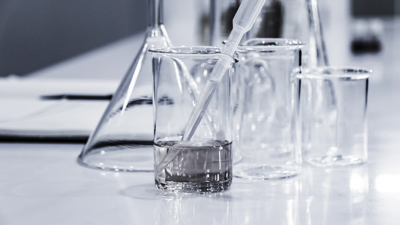 Laboratory beakers and pipettes for water quality analysis